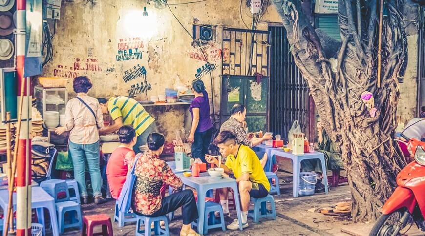 Enjoying street food in Hanoi